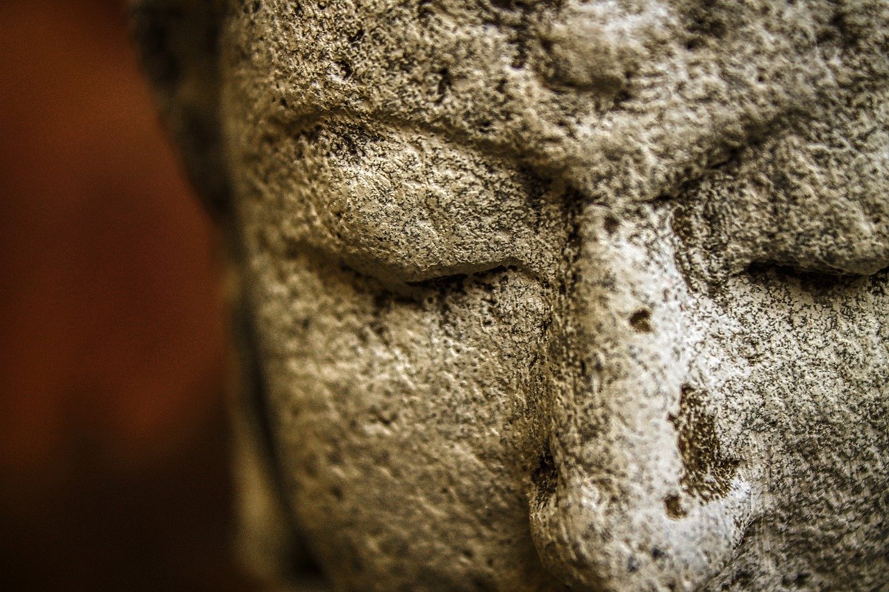 A stone buddha with closed eyes radiates inner vision